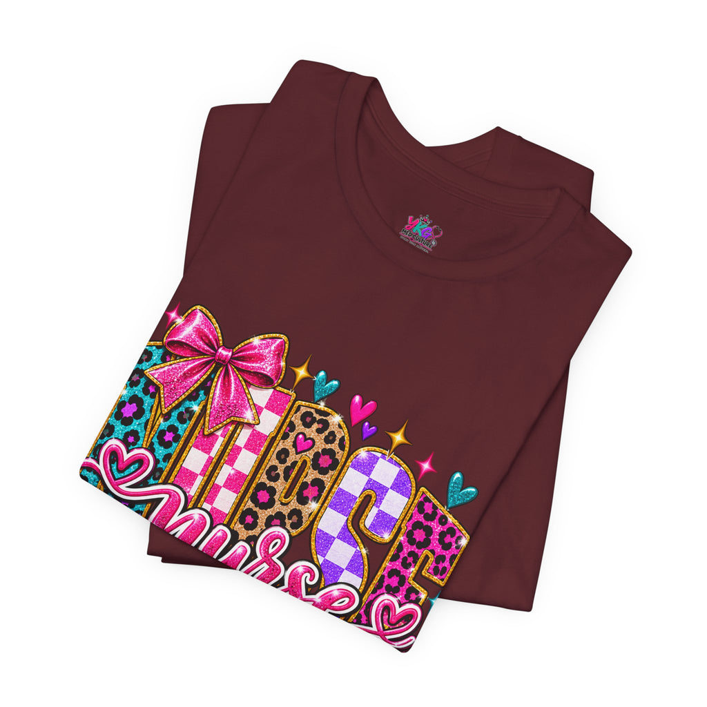 Nurse Graphic Tee — Colorful Leopard Scrub Letters with Hearts & Bow